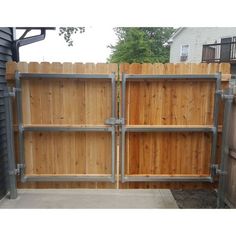 a wooden fence with metal bars on it