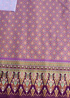 an image of a purple and gold cloth