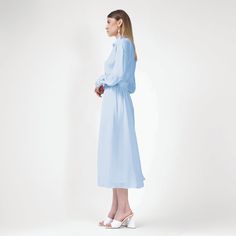 Baby Blue Midi Dress With Corset | BLUZAT | Wolf & Badger Elegant Midi Dress For Daywear, Elegant Solid Midi Dress For Daywear, Feminine Blue Midi Dress For Formal Occasions, Elegant Button-up Midi Dress With Button Cuffs, Elegant Button-up Dresses For Work, Spring Evening Midi Dress With Button Cuffs, Elegant Blue Button-up Dress, Elegant Buttoned Midi Dress For Daywear, Elegant Buttoned Dress For Daywear