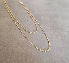 Simple and elegant gold plated duble necklace. Necklace length 1:  28 inch /  70 cm Necklace length 2: 23 inch / 60 cm Item will be shipped in a branded gift box. To continue shopping, check out my Etsy store: https://www.etsy.com/shop/HilaAssaJewelry **Standard Shipping Time** USA 6-12 days Canada 10-12 days Europe 8-10 days Upgrades are available at checkout Gold Double Strand Long Necklace As Gift, Gold Double Strand Necklace With Adjustable Chain, Gold Long Layered Necklace With Double Chain, Gold Double Chain Long Necklace, Double Strand Necklaces With Double Chain For Jewelry Making, Gold Layered Long Necklace With Double Chain, Gold Plated Multi-strand Necklace Gift, Gold Double Strand Necklace With Double Chain, Adjustable Gold Brass Long Necklace