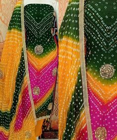 Welcome to Craftexo Fashion We are providing best quality of dress material for Indian Ethnic Women wear. FABRIC ;DETAILS TOP:  Jaipuri Silk with hand work (2.5mtr appx) Bottom: Shantoon 2.5 mtrs (approx) Dupatta: Jaipuri silk Bandhani hand work dupatta Note: These are not running fabrics so if your bust/hip size is more than 54 inches or you want dress style other than salwar kameez suit/ pant palazzo suit please contact us for desired dress style before order placement. COLOR:( As shown in the image, may vary due to lightning, flash light while photo shoot and according to screen settings and resolution ) Multicolor Dabka Work Designer Dress, Green Cotton Dress With Mirror Work, Green Unstitched Suit With Mirror Work For Navratri, Multicolor Mulmul Anarkali Set With Straight Kurta, Designer Bandhani Print Art Silk Dress, Designer Art Silk Dress With Bandhani Print, Multicolor Anarkali Set In Mulmul, Multicolor Anarkali Kurta In Mulmul, Fitted Green Salwar Kameez With Bandhani Print