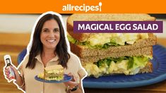 a woman holding a plate with a sandwich on it and an egg salad in front of her