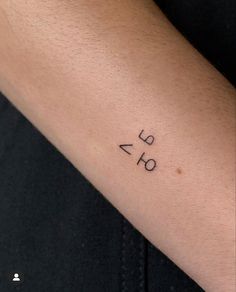 a person with a small tattoo on their arm