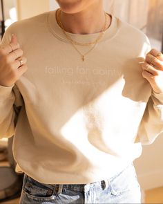 Fall in love with this falling for dainty sweatshirt! With its soft cotton fabric, cozy oversized fit, and classic crew neckline, you'll be sure to look and feel your best! The neutral nude color completes the comfy aesthetic. Add some of your falling for dainty jewelry as the perfect accessory. Details: -S,M,L,XL -Made with 50% sustainably and fairly grown USA cotton -Poly/cotton blend Beige Crew Neck Sweatshirt For Loungewear, Beige Crew Neck Sweatshirt For Fall, Everyday Cream Crew Neck Sweatshirt, Oversized Beige Sweatshirt For Everyday, Relaxed Fit Cream Sweatshirt For Everyday, Cream Relaxed Fit Sweatshirt For Everyday, Relaxed Fit Neutral Sweater For Everyday, Neutral Relaxed Fit Sweater For Everyday, Cream Crew Neck Sweatshirt For Layering