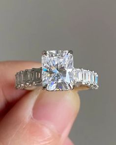 5 Ct Radiant Cut Moissanite Engagement Ring, Crushed Ice Radiant Cut Ring, Elongated Radiant, Hidden Halo Ring for Her ♻︎𝐃𝐢𝐚𝐦𝐨𝐧𝐝 𝐃𝐞𝐭𝐚𝐢𝐥𝐬 ⇛𝐃𝐞𝐭𝐚𝐢𝐥𝐬 𝐨𝐟 𝐦𝐚𝐢𝐧 (𝐜𝐞𝐧𝐭𝐞𝐫) 𝐬𝐭𝐨𝐧𝐞 ⇒Type of Diamond: Moissanite/Cubic Zirconia ⇒Size: 11 x 9 MM ⇒Weight: 4.79 Ct ⇒Shape: Radiant ⇒Color: D (White/colorless) ⇒Clarity: VVS1 ⇒Cut: Excellent ⇒Band width : 1.7mm ⇒Band thickness : 1.6mm ♻︎𝗥𝗶𝗻𝗴 𝗦𝗶𝘇𝗲 ⇒From 4 US - 15 US all ring sizes are available, even half and quarter sizes are also available. Just for an example 4, 4 ¼, 4 ½, 4 ¾, 5 US. Kindly choose the perfect ring size while placing an order, you can refer to the picture of the ring size chart I have uploaded as an image. ♻︎𝐄𝐧𝐠𝐫𝐚𝐯𝐢𝐧𝐠 ⇒We are offering you FREE engraving on all of our products (where possibl Elongated Radiant, Radiant Cut Ring, Radiant Cut Moissanite Engagement Ring, Radiant Cut Rings, Hidden Halo Ring, Types Of Diamonds, Jewelry Picture, Crushed Ice, Hidden Halo