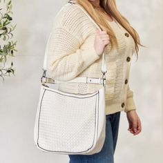 This Handbag Exudes Elegance And Durability. The Intricate Weaving Detail Showcases Fine Craftsmanship While Adding A Touch Of Texture And Uniqueness To Your Ensemble. With Its Versatile Size And Functional Crossbody Strap, This Handbag Effortlessly Combines Style And Practicality, Making It A Versatile Accessory For Everyday Use Or Special Occasions. Material: Vegan Leather Features: Advanced Vegan Leather, 100% Handmade Woven Pattern With Stitching Detail, And Long Adjustable And Detachable Strap Bag Size: Large Made In: Imported Imported Size: 11.5"* 5.5"* 17.5" White Square Bag With Adjustable Strap, White Bags With Adjustable Strap For Everyday Use, White Hobo Bag With Double Handle, White Large Capacity Crossbody Shoulder Bag, White Double Handle Shoulder Bag For On-the-go, White Shoulder Bag With Removable Pouch For Everyday, White Crossbody Bag For Daily Use, White Satchel For Everyday Use, White Shoulder Bag With Adjustable Strap For Daily Use