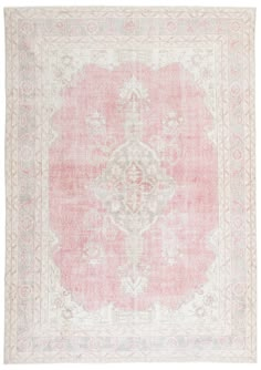 an antique rug with pink and white colors