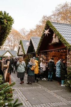 many people are walking around the christmas market