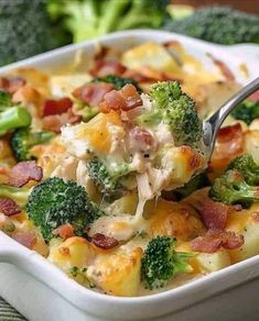 a spoon full of broccoli and ham casserole with bacon in it