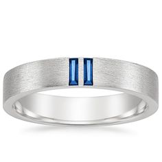 Men's 18K White Gold Zeus Sapphire Wedding Ring. Two baguette sapphires glimmer from this handsome band, adding a unique, colorful touch to a classic design. Modern Baguette Cut Sapphire Ring, Modern Baguette Cut Sapphire Ring For Anniversary, Modern Sapphire Baguette Cut Ring For Formal Occasions, Sapphire Anniversary Ring, Ice Necklace, White Gold Sapphire Ring, Brilliant Earth Rings, Sapphire Wedding Ring, Sapphire Wedding Rings