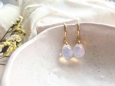 These simple, sophisticated earrings are great for everyday wear. With ethereal white opal Czech glass set against luxurious gold plated silver or sterling silver, these earrings are truly the perfect pair to add a touch of elegance to your everyday essentials.  A D D I T I O N A L * D E T A I L S - Hand crafted with Czech glass beads from Jablonec nad Nisou, an area renowned for its traditional production of high quality Czech glass.  - Available in sterling silver or gold plated sterling silve Everyday White Drop Earrings, Sophisticated Earrings, Glass Drop Earrings, Silver Gift Box, Earrings Everyday, Minimal Earrings, Earring Box, Teardrop Beads, Pretty Earrings