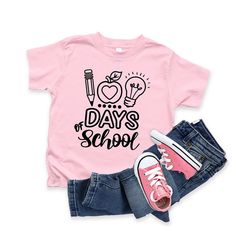 Looking for a cute tee for your kids? We have the perfect 100 Days Of School graphic tee addition to their closet! Also available in youth tees. Pink School Spirit T-shirt For Back To School, Fun Letter Print T-shirt For End Of School Year, Graphic Tee With Funny Print For School Year-end, End Of School Year Fun T-shirt With Letter Print, End Of School Year Funny Print Graphic Tee, Cute Slogan T-shirt For Back To School, Back To School T-shirt With Funny Print, Fun Text Print T-shirt For School Year End, Fun T-shirt For Back To School