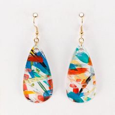 COLLECTION: Studio Graffiti (hand painted acrylic)COLORWAY: Carnival (orange, tangerine, turquoise, cobalt, black)STYLE: TeadropEARWIRE: Shiny Brass finish (hypoallergenic)SIZE: Approximately 2" long by 1" wideABOUT: A one-of-a-kind abstract painting you can wear every day! Each unique pair of earrings is created with a wide variety of colors and brush strokes on the backside of clear acrylic, then a final solid color paint covers the entire back. Each pair is one-of-a-kind and may vary slightly Earrings Teardrop, Color Paint, White Gift Boxes, Wood Earrings, Black Style, Polymer Clay Jewelry, Wholesale Jewelry, Brass Finish, Brush Strokes