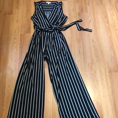 Nwot Monteau Woman’s Sleeveless Black And White Striped Wide Leg Flowy Jumpsuit V- Neck Elastic Waist With Tie Belt . 96%Polyester 4%Spandex Sz M Elegant Striped Sleeveless Jumpsuits And Rompers, Fitted Striped Sleeveless Jumpsuits And Rompers, Striped Sleeveless Jumpsuit For Spring, Striped Sleeveless Jumpsuits And Rompers For Spring, Sleeveless Striped Jumpsuits And Rompers For Spring, Flowy Jumpsuit, Wide Legs, Wide Leg Jumpsuit, Tie Belt