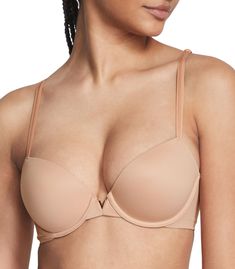 PRICES MAY VARY. Victoria's Secret Smooth Lightly Lined Demi Bra is designed to make you feel comfortable and look sexy. Featuring cloud-like padding, Smooth side-and-back panels, and gold V-hardware, this t shirt bra is a chic choice for everyday wear. This t shirt bra features lightly lined, ultra-soft pads and underwire cups that offer just the right amount of support. Get a perfect fit with this t-shirt bra's adjustable straps that also convert to crossback so you can hide them under sleevel Cheap Elegant Nude Bra, Padded Bra For Women, Triumph Bra, Low Cut Bra, Tshirt Bras, Cami Bra, Lounge Bra, Comfy Bra, Bra Models