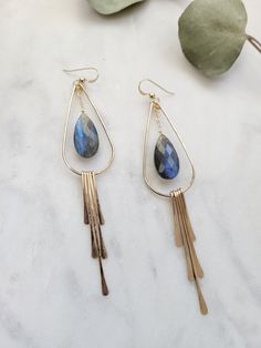 The Labradorite Fringe Earrings are a beautiful statement pair of earrings! One of my favorites! Definitely a special gift for a friend or yourself! . ** Blue and Purple Blue stones left. Please refer to 3rd picture Each earring is hand formed and hammered for texture and shape. The length of the earrings are about 3 1/2 inches. Each piece is handmade and may vary slightly as well as the stones as they are natural. ** The stones will vary in color and in size. Some are more blue, green, or yello Blue Stones, Gift For A Friend, Earrings Statement, Fringe Earrings, Blue Stone, My Favorites, Gemstone Earrings, Special Gift, Labradorite