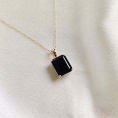 This stunning pendant is set in 14k Solid Yellow Gold with Natural Black Onyx with utmost precision. It is a unique gemstone pendant for nearly every occasion and is completely hassle-free jewelry. ITEM DETAILS: * GEM: Black Onyx * GEM Size: 10x12mm * GEM Shape: Octagon (Emerald Cut) * Gem Weight: 6.00 carats * Gold Purity: 14KT  * Gold Weight: 1.07 gram * Total Weight of the Pendant: 2.27 gram The Gold purity is guaranteed and it comes with an authentic 14KT gold hallmark. Since my items are ha Black Gem Necklace, Elegant Black 14k Gold Jewelry, Timeless Black Spinel Jewelry Gift, 14k Gold Necklace With Black Enamel For Gift, Elegant Black Onyx Necklace, Timeless Black Enamel Jewelry As A Gift, Timeless Black Enamel Jewelry As Gift, Timeless Black Enamel Jewelry For Gifts, Black Pendant Necklace For Formal Occasions