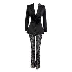 Upgrade your party look with our Moira set. This two-piece set includes a 3D flower decor backless satin blazer and faux pearl embroidered mesh pants. Perfect for any special event, this set will elevate your style with its unique design. Feel confident and stylish in our Moira set. Fabric: Non-Stretch Material: Polyester Fiber Embellished Fitted Sets For Night Out, Luxury Sequin Party Sets, Luxury Sequined Party Sets, Chic Embellished Sets For Party, Party Tuxedo Pantsuit With Long Sleeves, Tailored Long Sleeve Pantsuit For Party, Chic Embellished Formal Sets, Elegant Fall Party Pantsuit, Glamorous Spring Formal Pantsuit