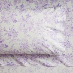 two pillow cases with purple flowers on them