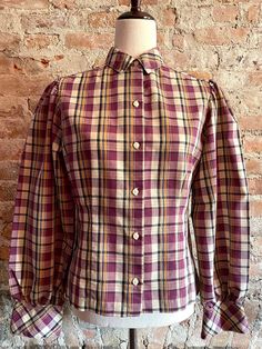 "Beautifully made cotton blouse by College Town, in a late 1970's prairie style with slightly puffed sleeves and a fitted bodice with tucked seams for shaping. The shirt is in excellent condition and appears to have hardly been worn. The tag lists it as a Size 9/10 which translates to a contemporary Size 6 or smaller. Shoulder to shoulder measures 14\" across, bust is 35\" and waist is 31\".  The sleeves measure 24\" from shoulder seam to wrist." Fall Cotton Puff Sleeve Fitted Top, Fitted Cotton Puff Sleeve Top For Fall, Fitted Puff Sleeve Cotton Top For Fall, Fall Cotton Puff Sleeve Top With Gathered Sleeves, Classic Cotton Tops With Balloon Sleeves, Fall Cotton Puff Sleeve Top With Blouson Sleeves, Cotton Puff Sleeve Top With Gathered Sleeves, Fitted Cotton Puff Sleeve Top For Daywear, Fall Fitted Puff Sleeve Top With Gathered Sleeves