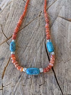 Pretty beaded necklace made with Carnelian and real Turquoise. Simple yet bold. Layer with other necklaces for your own look. Southwestern Turquoise Gemstone Necklace For Healing, Artisan Turquoise Agate Beaded Necklaces, Artisan Turquoise Agate Beaded Necklace, Southwestern Orange Beaded Necklaces With Round Beads, Southwestern Gemstone Beaded Necklaces For Healing, Southwestern Orange Beaded Necklace With Round Beads, Artisan Turquoise Agate Necklace With Gemstone Beads, Artisan Turquoise Necklace With Agate Beads, Bohemian Orange Gemstone Beads And Cabochons