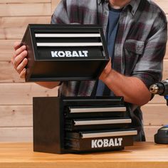 a man working on a kobalt tool box