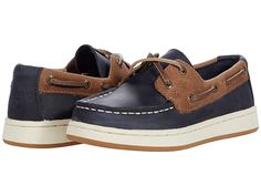 Sperry Kids Sperry Cup II Boat (Little Kid/Big Kid) - Boy's Shoes : Navy/Tan : Rock the Sperry Kids Sperry Cup II Boat shoes with just about any casual ensemble for a handsome look. Leather upper made with genuine hand-sewn Tru-Moc construction for durable comfort. 360° Lacing System with genuine raw hide laces and rustproof eyelets for a secure fit. Textile lining and insole. Memory foam footbed. Non-marking rubber outsole designed for great traction on wet surfaces. Imported. Measurements: Wei Navy Casual Sneakers With Stitched Sole, Navy Casual Sneakers With Leather Sole, Casual Boat Shoes With Plain Toe, Casual Leather Low-top Boat Shoes, Casual Leather Boat Shoes With Textured Sole, Casual Brown Boat Shoes For Fall, Casual Leather Boat Shoes For Fall, Casual Brown Low-top Boat Shoes, Casual Boat Shoes With Rubber Sole And Moc Toe