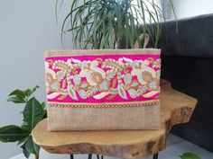 This floral clutch will bring elegance to your style. It will be chic with jeans or dresses and you may use this boho bag both day and night. This clutch wallet is perfectly handmade with high quality natural jute fabric. Designed with a silk bohemian embroidery and a tassel. Clutch has a pink silk satin interfacing and a padding inside to stand upright. Closes with a magnet closing. This bag is designed to fit all the things you need for comfortable everyday busy life. There will be enough spac Trendy Wedding Clutch Bag, Beige Clutch Pouch For Parties, Chic Handmade Clutch, Chic Rectangular Pink Pouch, Chic Pink Rectangular Pouch, Handmade Chic Clutch, Trendy Clutch Evening Bag For Wedding, Elegant Handmade Pink Clutch, Chic Handmade Wedding Bags