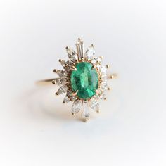 Laina | 14K 1 Carat Oval Emerald & Diamond Fancy Halo Luxury Ring – Emi Conner Jewelry Emerald Halo Ring, Vintage Engagement Rings Unique 1920s Emerald, 2023 Rings, Art Deco Emerald Ring, Emerald Ring Vintage, Fancy Jewelry Necklace, Luxury Ring, Emerald Rings, Cute Engagement Rings