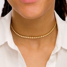 Simple yet stunning, this diamond cushion frames choker necklace in 10K gold is a trendsetting take on a classic look. Created in warm 10K gold This tennis-style design features a row of sparkling diamonds - the largest the 1/10 ct. center stone - each wrapped in a cushion-shaped frame. Sculpted cushion-shaped beads gleam further up the chain. Radiant with 2 cts. t.w. of diamonds This 14.0-inch necklace with 2.0-inch extender secures with a lobster claw clasp. Classic Yellow Gold Single Strand Diamond Necklace, Classic Single Strand Yellow Gold Diamond Necklace, Formal Gold Tennis Necklace With Single Cut Diamonds, Classic Gold Diamond Necklace, Elegant Diamond Choker Necklace For Anniversary, Elegant Diamond Choker For Anniversary, Elegant Anniversary Diamond Choker Necklace, Classic Formal Diamond Choker Necklace, Elegant 14k Gold Tennis Necklace