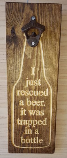 a wooden sign that says i just received a beer it was trapped in a bottle