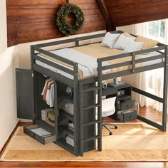 a bunk bed with drawers underneath it and a wreath hanging on the wall behind it