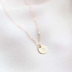 The daintiest initial necklace, available in 14k gold fill or sterling silver. It's the perfect personalized gift for anyone -- perfect as a bridesmaid necklace, friend's birthday necklace, or anyone else you love! Dainty, personal, and minimal. Find more at Simple & Dainty. Delicate Everyday Charm Necklace With Initial Pendant, Delicate Everyday Charm Necklaces With Initial Pendant, Dainty Charm Necklaces With Initial Pendant For Everyday, Everyday Tiny Initial Pendant Charm Necklace, Classic Name Necklace With Initial Pendant And Delicate Chain, Elegant Monogram Charm Necklaces For Everyday, Elegant Monogram Charm Necklace For Everyday, Elegant Everyday Monogram Charm Necklace, Dainty Initial Pendant Charm Necklace For Gift