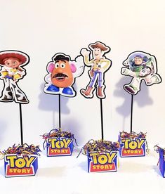 toy story centerpieces are displayed in front of a white background with blue boxes