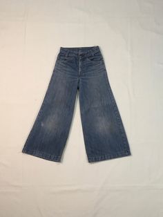 "1970s Levis bell bottom jeans made in USA orange tab SCOVILL zipper fly hemmed authentic age wear fade, fray, faded stains labeled 25 x 32, smaller/shorter, see below measures, lying flat, waist-12\" rise-10\" inseam-23 1/2\" hem-12\" hip-17 1/2\" out seam-33\" about 2\" could be added to length if unhemmed" Vintage Dark Wash Flare Jeans, Vintage Medium Wash Flare Jeans, Faded Vintage Wide-leg Bottoms, Vintage Blue Flare Jeans, Retro Flare Jeans In Medium Wash, Retro Medium Wash Full Length Flare Jeans, Retro Full-length Light Wash Flare Jeans, Vintage Wide Leg Washed Pants, Retro Full Length Medium Wash Flare Jeans