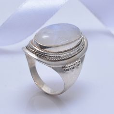 Adjustable Moonstone Crystal Ring With Stone Setting, Oval Moonstone Ring With Stones, Adjustable Moonstone Ring With Large Stone, Adjustable Moonstone Ring With Stone Setting, Adjustable Moonstone Ring Perfect For Gifts, Adjustable White Rings With Stones, Oval Moonstone Rings For Jewelry Making, Moonstone Ring With Large Stone For Wedding, Moonstone Rings With Stone Setting As Gift