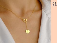 14K Solid Gold Initial Heart Lariat Necklace Elevate your style with our 14K Solid Gold Initial Heart Lariat Necklace. This personalized necklace features a delicate heart charm and can be customized with your initial, making it a perfect gift for yourself or a loved one. The minimalist design adds a touch of elegance to any outfit, making it ideal for daily wear or special occasions. ✿ Features:  ❤Made to Order ❤Handmade item ❤Dispatches from a Mother-Owned Small Business ❤Ready to Ship in 1-3 Heart-shaped Lariat Necklace With Clavicle Chain, Valentine's Day Heart Pendant Lariat Necklace, Valentine's Day Dainty Lariat Necklace, Dainty Lariat Necklace With Heart Charm As Gift, Heart-shaped Lariat Necklace For Anniversary, Dainty Lariat Necklace For Valentine's Day, Heart Charm Lariat Necklace For Valentine's Day Gift, Heart Lariat Necklace For Valentine's Day Gift, Valentine's Day Gift Lariat Necklace With Heart Pendant