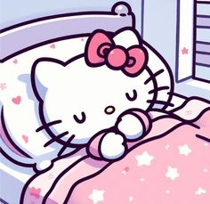 hello kitty sleeping in her bed with pink sheets