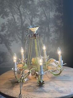 a chandelier with candles on top of it