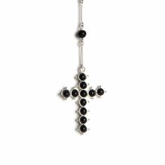 Born from the ever-present rosary prayer beads found in holy places and markets around the city of San Miguel de Allende, the Saint Mia Rosary Style Necklace is adorned with a beaded cross that hangs from an 8-inch drop. Fully adjustable, this necklace is wholly contemporary yet steeped in Mexican history. The cross, which is double-sided, is made with vintage beads in an open setting. Inspired by a Patron Saint with a heart of gold, this piece is made to be original, as it's available in a vari Adjustable Cross Necklace With Black Beads, Adjustable Black Beads Cross Necklace, Spiritual Crucifix Jewelry With 8mm Beads, Gothic Beaded Cross Jewelry, Silver Spiritual Cross Beaded Necklace, Silver Cross Beaded Necklace For Spiritual Style, Spiritual Silver Cross Beaded Necklace, Spiritual Black Cross Beaded Necklace, Silver Rosary With Black Beads And Crucifix