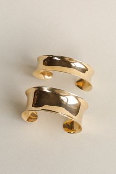 A solid brass cuff with an organic, concave shape. Hand forged, hammered, and buffed to a high polish. Wide style is 1" wide, medium is 3/4" and narrow style is 1/2" and all can be adjusted slightly. We recommend the Polishing Cloth for an easy way to keep this brass cuff shiny. Classic Hammered Cuff Bracelet, Formal Polished Brass Cuff Bracelet, Polished Brass Bangle Cuff Bracelet, Polished Brass Cuff Bracelet, Elegant Hammered Brass Cuff Bracelet, Hammered Yellow Gold Brass Cuff Bracelet, Brass Cuff, Hammered Metal, Metal Shop