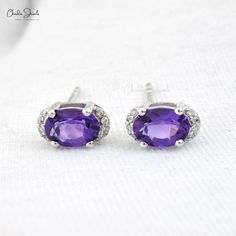 Description Elevate your bridal look with these stunning Half Halo Birthstone Earrings in 14k white gold. Featuring a 7x5mm amethyst center stone, accented by dazzling diamonds, these earrings add a touch of elegance and personal charm to your wedding day. A perfect choice for timeless bridal studs. Product Details SKU CJ E 1160A AY WG NP Metal 14K solid gold Closing mechanism Push Back Product dimension 9.51x5.13x4.52mm Birthstone February Certification - Amethyst Details Stone size 7x5mm Quali Amethyst Earring, Amethyst Studs, Birthstone Earrings, Birthstone Earring, Amethyst Earrings, February Birth Stone, Gold Drop Earrings, Amethyst Stone, Summer Jewelry