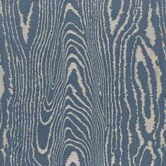 a blue and white rug with wavy lines on it