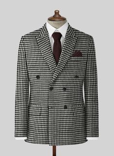 In black and white, the double breasted tweed suit boasts a heritage inspired houndstooth check design for a modern take on a menswear classic. Wear this statement-making design with a white crew-neck t-shirt and black boots for a novel take on a tailored look. 
 
Look Includes   Big BW Houndstooth Tweed Fabric   Double Breasted Jacket Style  Peak Lapel  Horn Royal Black Buttons  Single Vent  Three Cuff Buttons  Two welted back pockets on trousers    Click 'Customize Now' to modify the look if n