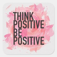 the words think positive are painted in pink and black on a white square sticker