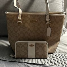 Coach Signature Zip Top Tote With Matching Wallet F58294 Tan/Cream Signature Coated Canvas Inside Zip, Cell Phone And Multifunction Pockets Zip-Top Closure, Fabric Lining Handles With 8 3/4' Drop 10 1/2" (L) X 10 1/4" (H) 4 1/4" (W) Luxury Beige Wallet For Everyday Use, Luxury Beige Wallet For Daily Use, Luxury Everyday Beige Wallets, Luxury Beige Everyday Wallet, Classic Beige Shoulder Bag With Interior Card Slots, Classic Beige Wallets With Interior Card Slots, Beige Leather Wallet With Removable Pouch, Cream Leather Wallets For Everyday Use, Luxury Beige Wallet