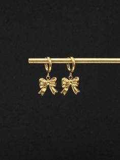 Introducing our small and delightful Bowknot Drop Earring Hoops  Crafted from stainless steel or 18K gold plated stainless steel, they offer both durability and a luxurious aesthetic. The focal point of these earrings is the adorable bowknot charms that dangle delicately from the hoops. Their petite size adds a touch of femininity and playfulness to the overall design. EARRINGS SPECIFICATIONS - size: hoops diameter - 12mm/outside and 8.5mm/inside, total earring length with charms - 28mm - stainl Gold Tarnish Resistant Huggie Earrings For Gift, Gold Tarnish Resistant Huggie Earrings As Gift, Gold Tarnish-resistant Huggie Earrings As A Gift, Silver Gold-plated Huggie Earrings Gift, Silver Gold Plated Huggie Earrings Gift, Yellow Gold Metal Huggie Earrings Gift, Rose Gold Plated Huggie Earrings As Gift, Stainless Steel Tarnish Resistant Huggie Earrings For Gifts, Gift Stainless Steel Tarnish Resistant Huggie Earrings