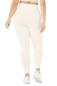 An on-trend high waistline on our classic Airbrush legging. Spotted on basically every it-girl, the High-Waist Airbrush Legging has an on-trend rise and all the best assets of the classic version, like no side seams and a yogi-tested fit that lifts and sculpts. Sculpts, smooths & lifts! No side seams & flat-locked seams for extra comfort Designed & uniquely fit to flatter every size Wear-tested by our in-house team for the perfect fit Alo Yoga® | High-Waist Airbrush Legging in Ivory, Comfort Design, Shopper Tote, It Girl, Alo Yoga, Yoga Women, All The Best, Snug Fit, White Jeans, Muse