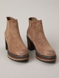 These stylish booties feature a soft suede upper, a side zipper for easy on and off, and a stacked heel for a touch of height. They're the perfect addition to your wardrobe for any occasion, from a day at the office to a night out on the town. Trendy Suede Boots With Zipper Closure, Chic Suede Ankle Platform Boots, Chic Suede Boots With Zipper Closure, Fall Suede Heeled Boots With Zipper, Fall Suede Heeled Boots With Zipper Closure, Suede Heeled Boots With Zipper And Round Toe, Suede Heeled Boots With Zipper Closure And Round Toe, Suede Ankle Boots With Zipper, Suede Ankle Boots With Zipper Closure