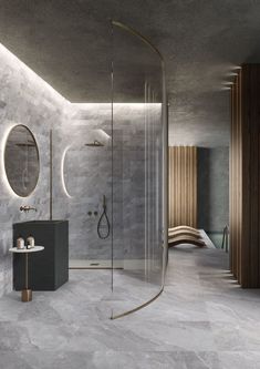 a bathroom with a shower, sink and mirror on the wall next to each other